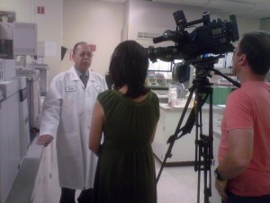 Photo of Dr. Nirmal Saini, branch chief at CDFA's Center for Analytical Chemistry, being interviewed by KNTV reporter Vicky Nguyen.
