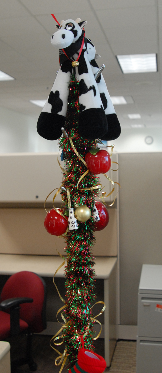 Can't fit a tree in your cubicle over at the dairy  office? No problem. Decorate the coat rack instead!