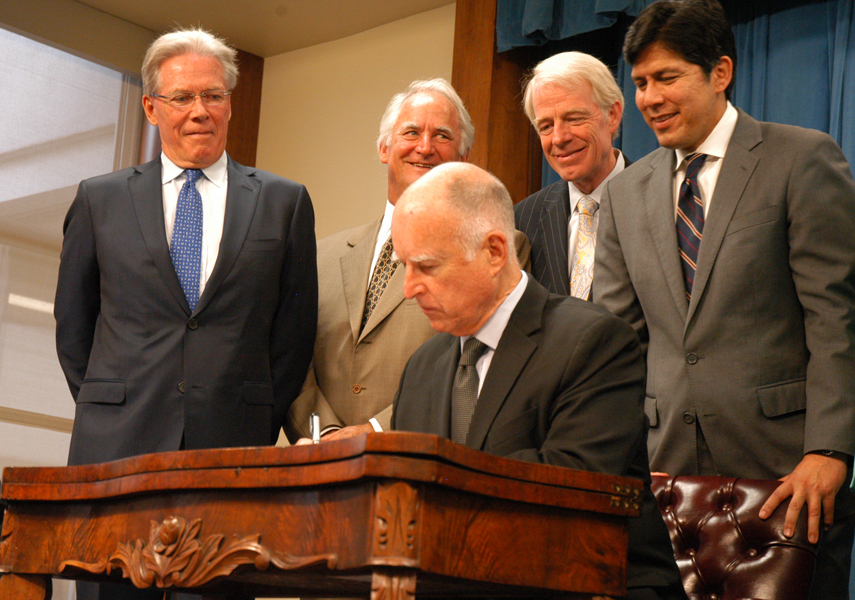 At the Sept. 16 signing ceremony for California's landmark groundwater legislation, Governor Brown is joined by (from left) State Board of Food and Agriculture President Craig McNamara, Board Member and Driscoll's Chairman Miles Reiter, Assemblymember Roger Dickinson, and Senate President Pro Tempore-elect Kevin DeLeón.
