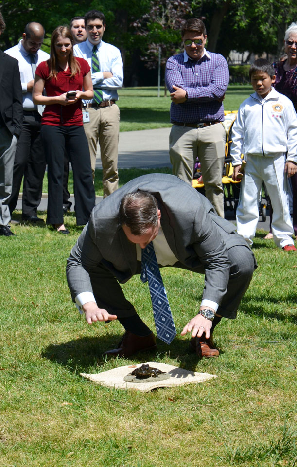 CDFA Undersecreteary Jim Houston exhorts 'Clayton Kerfrog' to jump at today's annual State Capitol frog jump contest in Sacramento. The event is to promote the upcoming Calaveras County Fair and Jumping Frog Jubilee, May 14-17.   