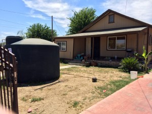 A water tank installed in an East Porterville yard provides a temporary solution during the ongoing drought.