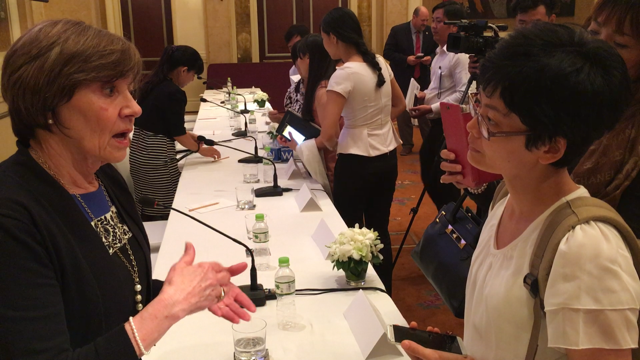 Secretary Ross with a Vietnamese reporter last week in Ho Chi Minh City. 