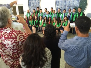 Upcoming graduates of the CSin3 program gathers for a group photo as their family members snap pictures.