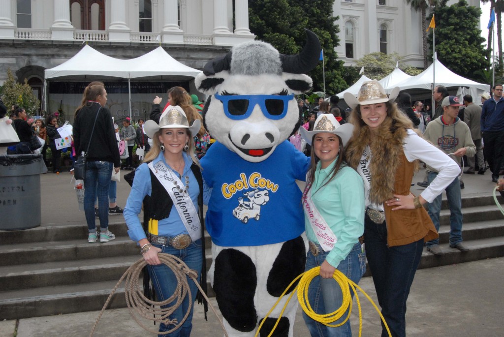 Ag Day attendees posing with a mascot
