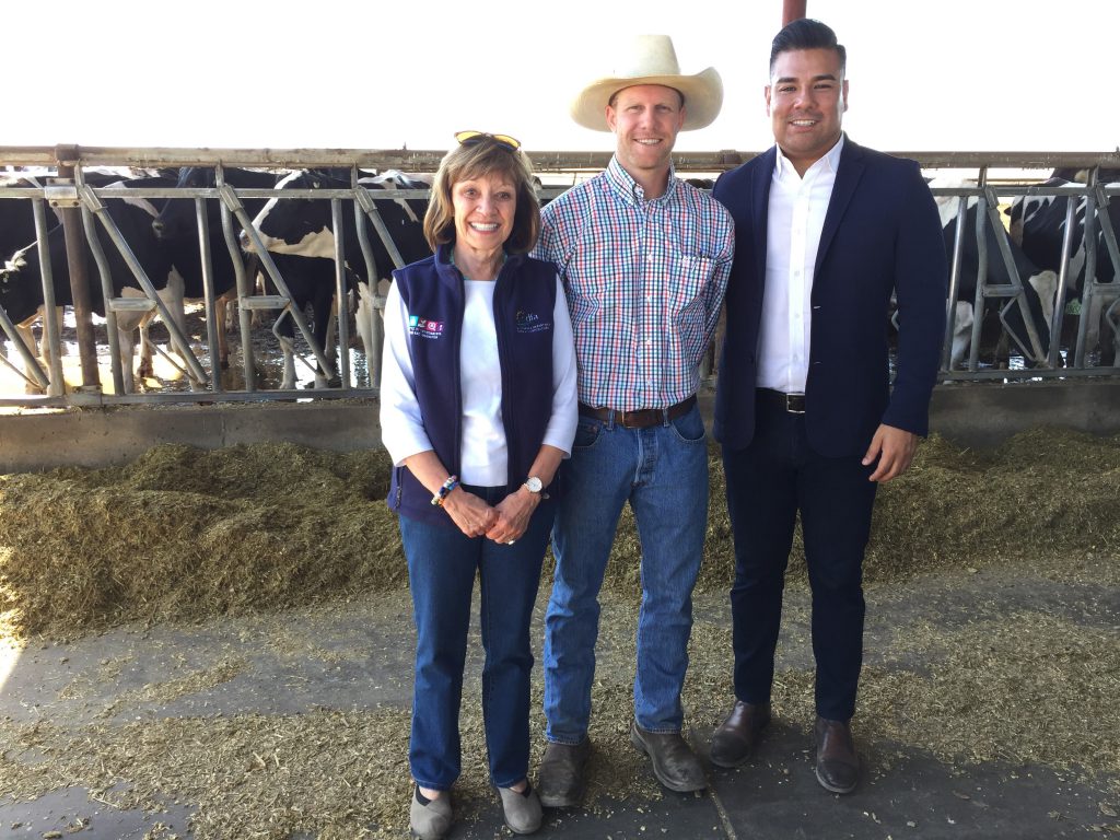 From left: CDFA Secretary Karen Ross with dairyman Eric TeVelde and Senator Ricardo Lara, touring Open Sky Ranch Dairy.
