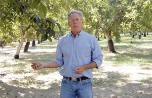 Craig McNamara in an orchard