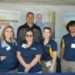 UC Davis students pose in their Ag Day booth