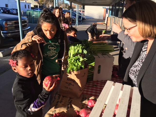 Kids inspecting vegetables