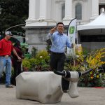 Assemblymember Vince Fong practices lasso on a dummy cow