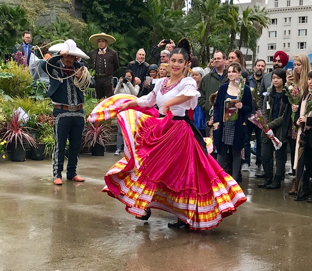 Charros dancing and lassoing in the rain