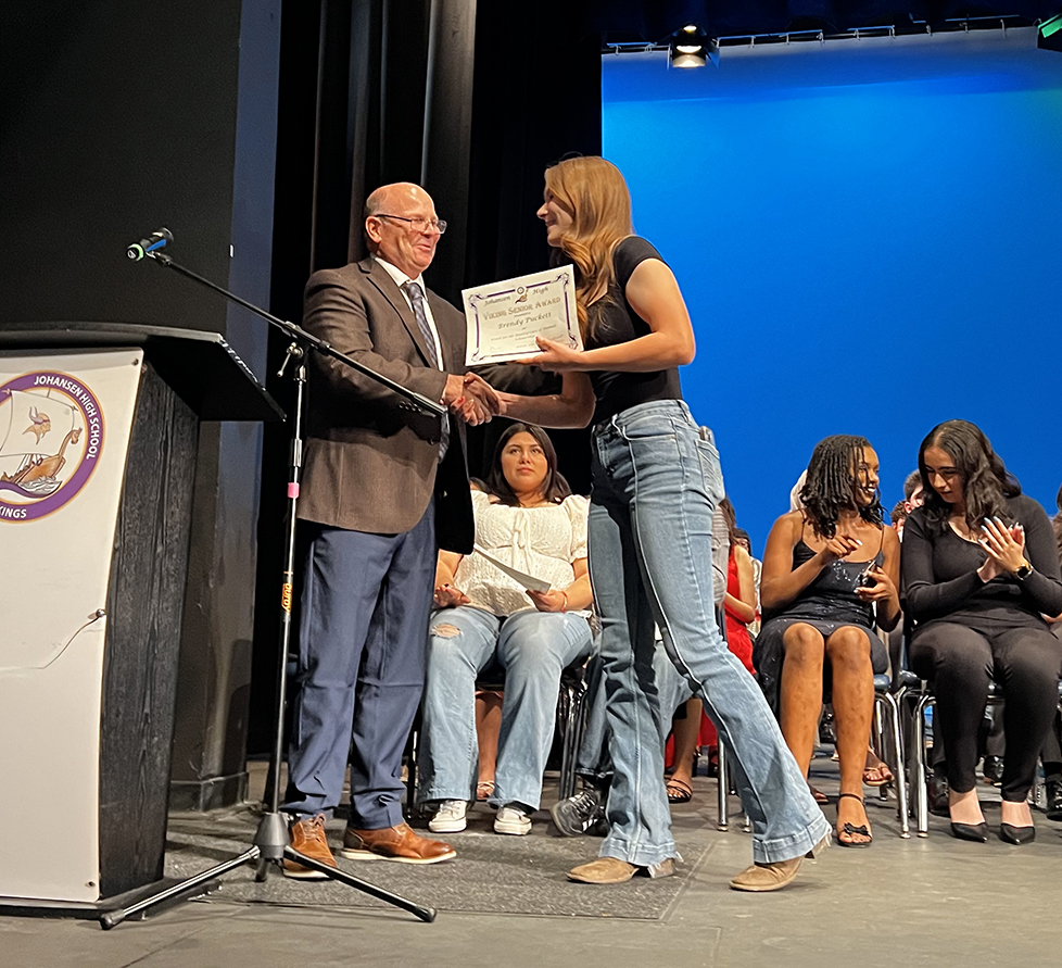 Photo: Mike Francesconi, Branch Chief with CDFA’s Fairs & Expositions Branch, presents a $10,000 scholarship on behalf of the Youth for the Quality Care of Animals (YQCA) program to California FFA student Brendy Puckett, a senior at Peter Johansen High School in Modesto. Brendy earned the program’s top award, with six other scholarships ranging from $2,500 to $5,000 going to students around the nation.