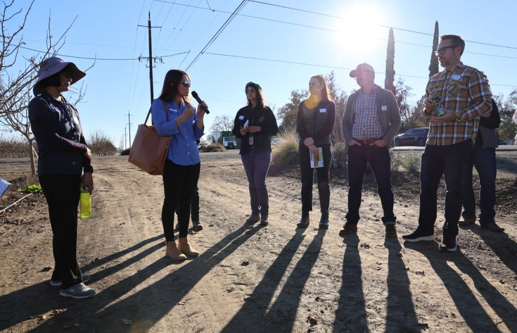 CDFA and legislative staff touring a farm